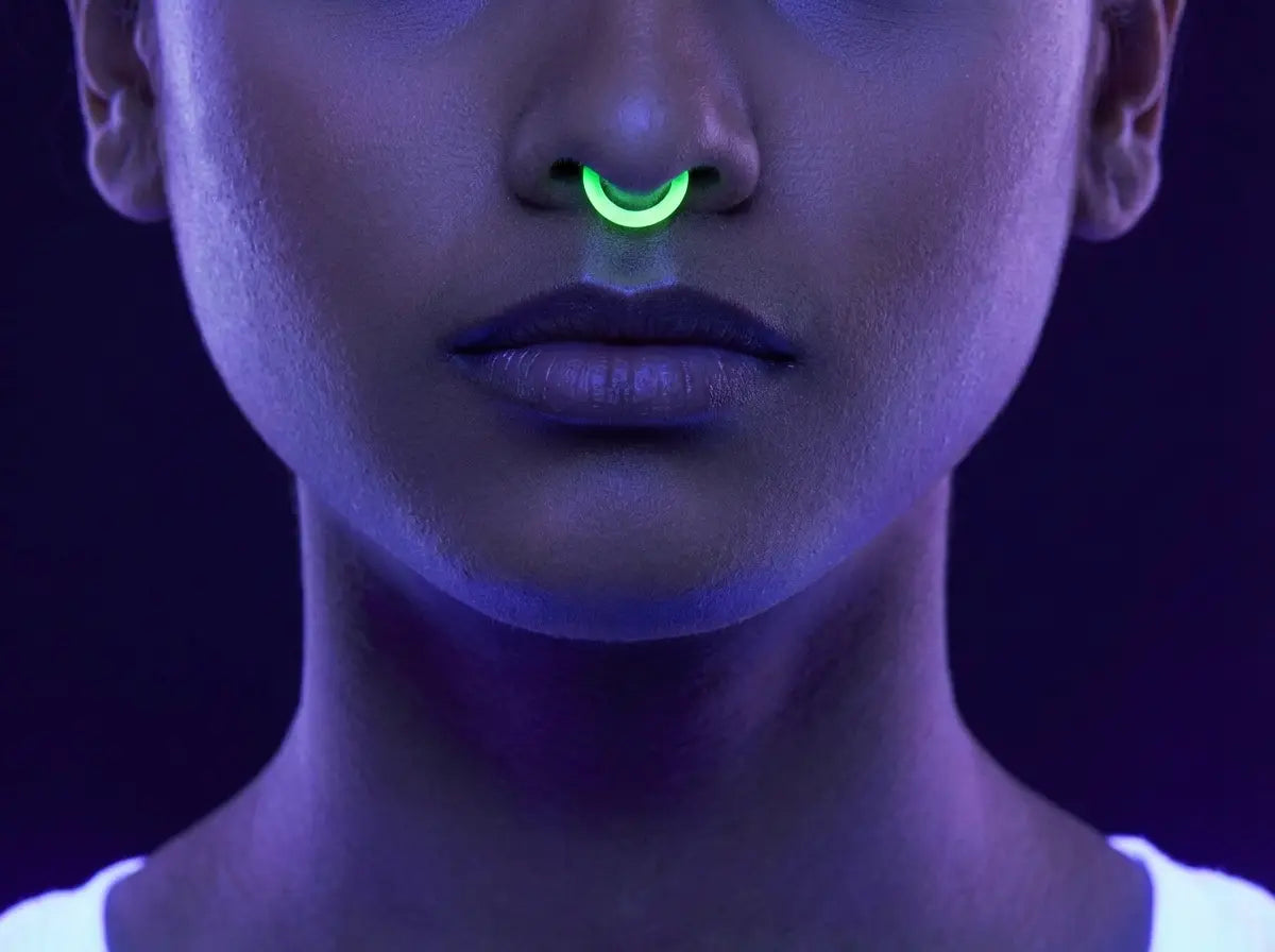 A yellow ring glowing under blacklight, close up